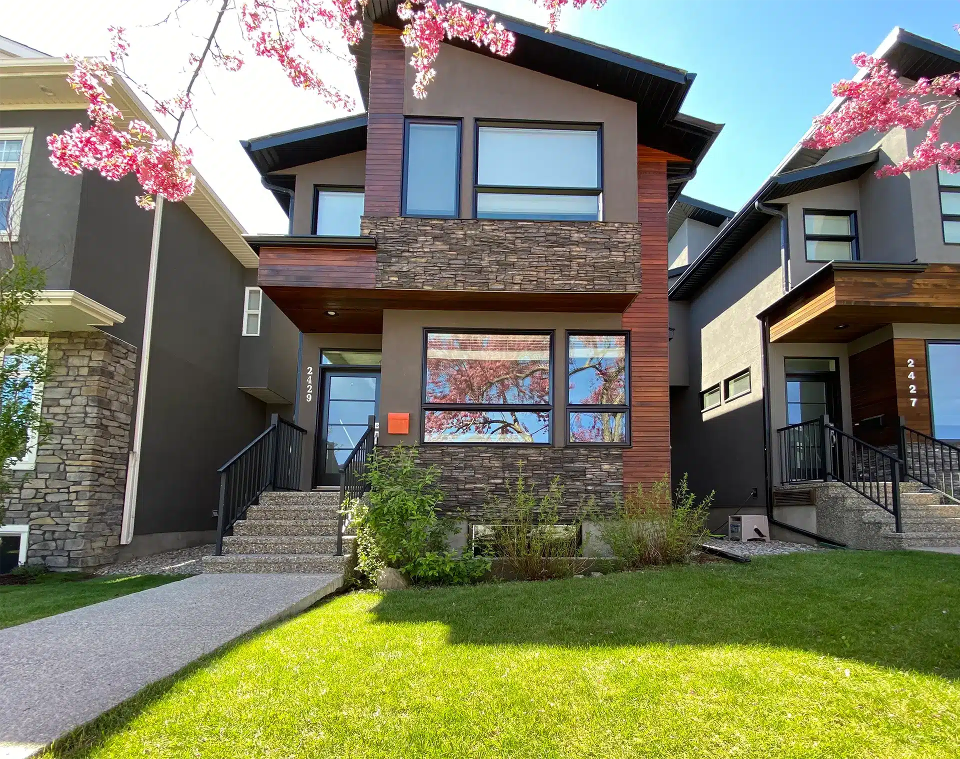 Modern stucco and stained-wood exterior